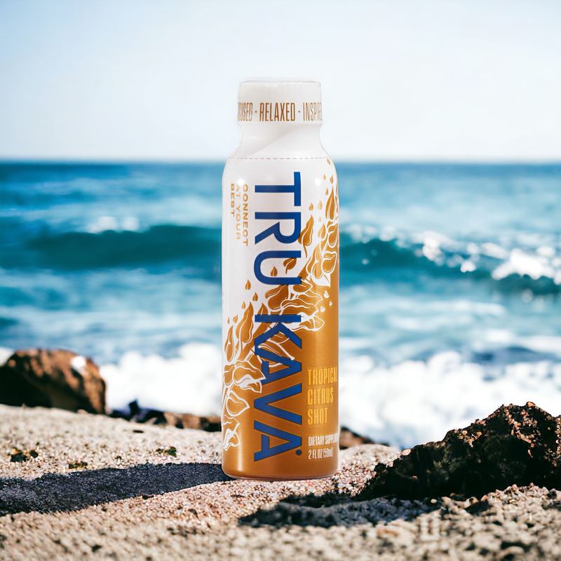 TRU KAVA Tropical Citrus shot on a beach