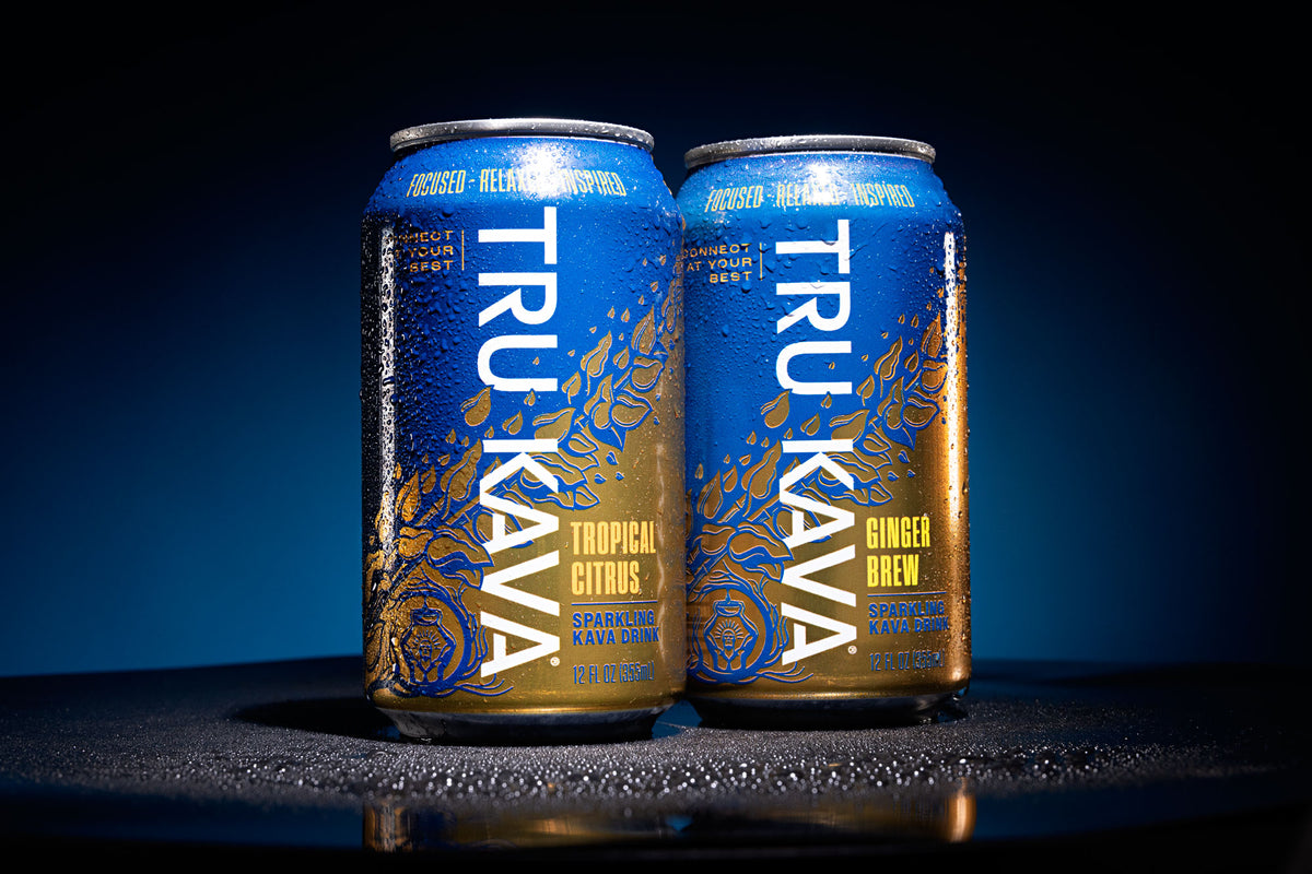 TRU KAVA Sparkling Kava in Tropical Citrus and Ginger Brew, two chilled cans standing together