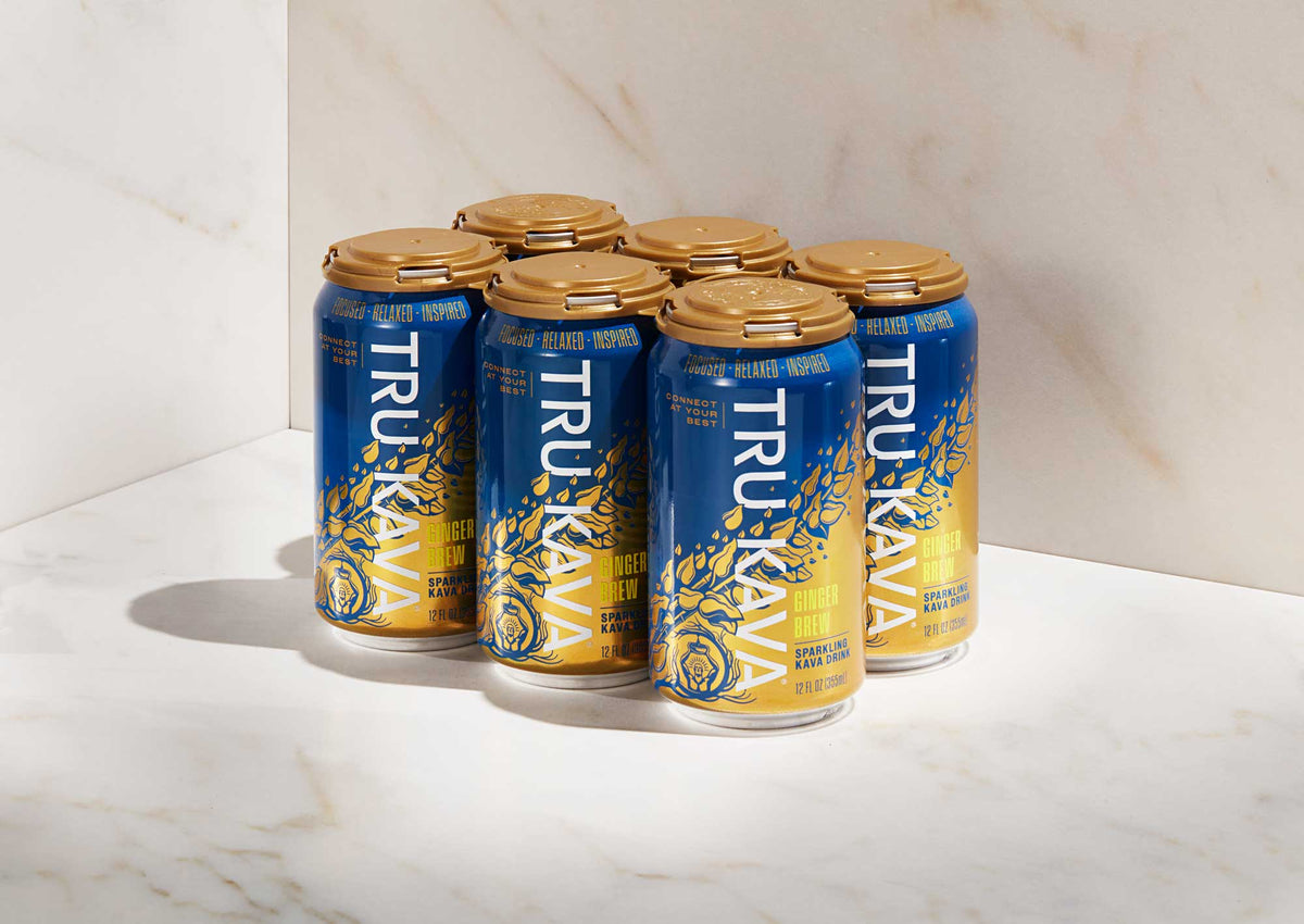 TRU KAVA Ginger Brew Sparkling Kava six-pack on a marble studio surface