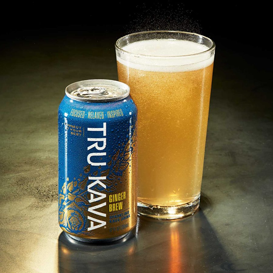 TRU KAVA Ginger Brew sparkling kava can beside a poured glass