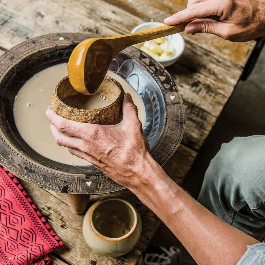 Prepared kava being served from a carved bowl